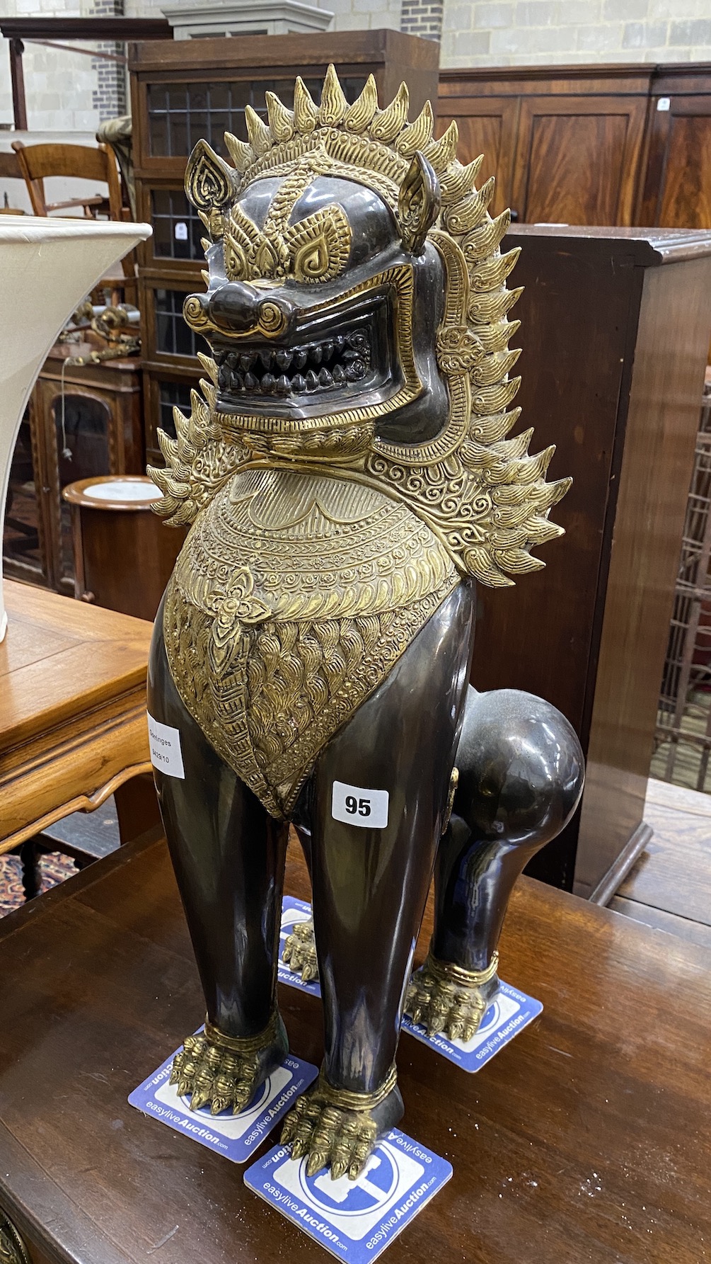 A Thai gilt metal lion dog, height 60cm